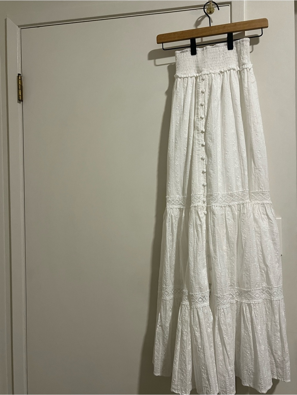 White Maxi Tiered Eyelet Skirt. One hole shown in picture